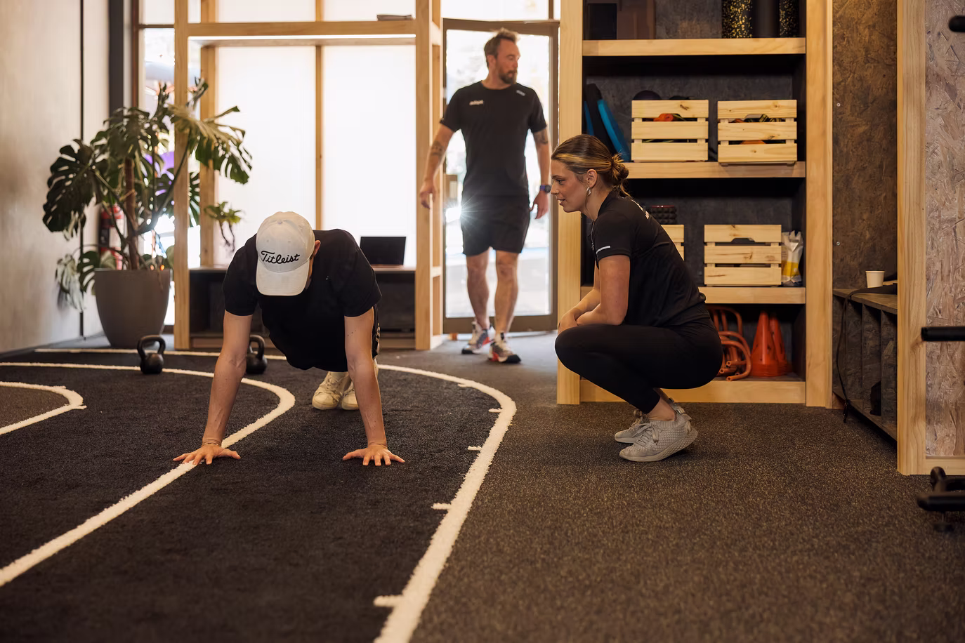 A client doing push ups during a coached session at Adapt, North Sydney